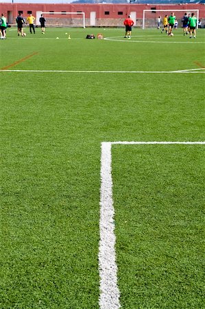 simsearch:6118-07354015,k - Detail of a football field with some players training Photographie de stock - Aubaine LD & Abonnement, Code: 400-03962854