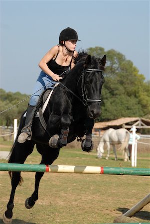 simsearch:400-04256024,k - young teenager and her black horse in training of jumping competition Stock Photo - Budget Royalty-Free & Subscription, Code: 400-03963229