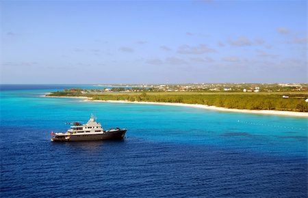 simsearch:696-03397610,k - Luxury yacht and helicopter moored near exotic Caribbean island Stock Photo - Budget Royalty-Free & Subscription, Code: 400-03974377