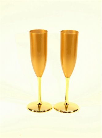 strikerx98 (artist) - A pair of gold colored champagne glasses ready for a toast. Stock Photo - Budget Royalty-Free & Subscription, Code: 400-03974515