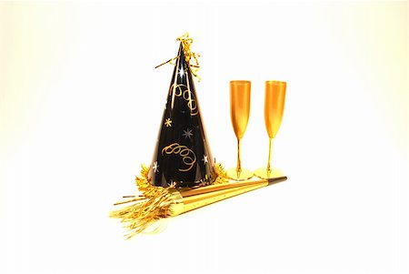 simsearch:400-06064766,k - A New Years celebration complete with party hat and champagne. Stockbilder - Microstock & Abonnement, Bildnummer: 400-03974517