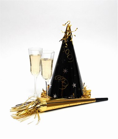 simsearch:400-06064766,k - A New Years celebration complete with party hat and champagne. Stockbilder - Microstock & Abonnement, Bildnummer: 400-03974521