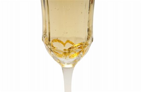 strikerx98 (artist) - A glass of champagne sports two wedding rings that take on a heart shape due to the glass shape.. Stock Photo - Budget Royalty-Free & Subscription, Code: 400-03974537