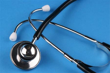 racnus (artist) - A stethoscope in plain blue background. Fotografie stock - Microstock e Abbonamento, Codice: 400-03974563