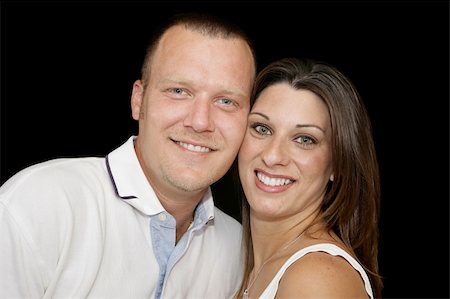 Closeup portrait of a young married couple over black background. Stock Photo - Budget Royalty-Free & Subscription, Code: 400-03975151