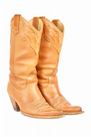 simsearch:614-08873325,k - A pair of used cowboy boots isolated on white background Foto de stock - Super Valor sin royalties y Suscripción, Código: 400-03975165