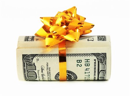 simsearch:400-04717440,k - Money roll wrapped in a golden ribbon with a bow on top Stock Photo - Budget Royalty-Free & Subscription, Code: 400-03975389