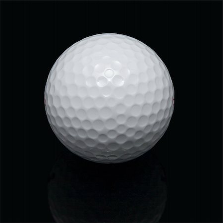 Golf ball on the black background Fotografie stock - Microstock e Abbonamento, Codice: 400-03975918