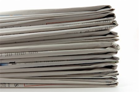 simsearch:400-04682528,k - Stack of newspaper in isolated white background Stock Photo - Budget Royalty-Free & Subscription, Code: 400-03977204