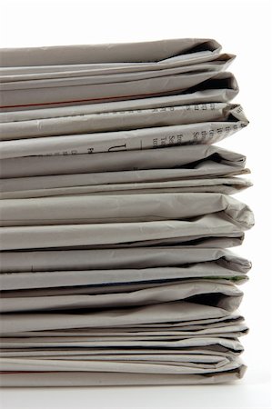 simsearch:400-07774296,k - Stack of newspaper in isolated white background Stockbilder - Microstock & Abonnement, Bildnummer: 400-03977205