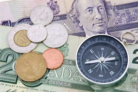 Compass on canadian dollar bill and coins Stock Photo - Budget Royalty-Free & Subscription, Code: 400-03977211