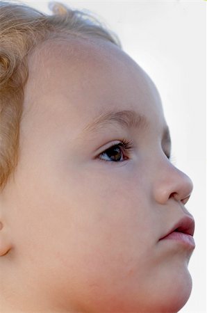 simsearch:400-05284316,k - Young boy head shot while looking up in serious stare Stockbilder - Microstock & Abonnement, Bildnummer: 400-03978044