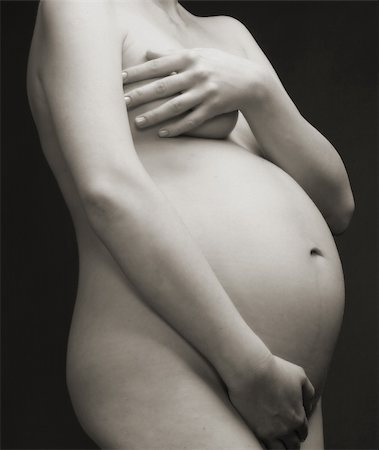 simsearch:400-04334843,k - close up view of a pregnant woman's stomach Foto de stock - Royalty-Free Super Valor e Assinatura, Número: 400-03978547