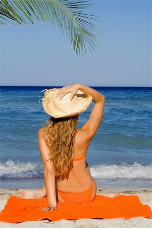 young woman on beach Stock Photo - Budget Royalty-Free & Subscription, Code: 400-03978550