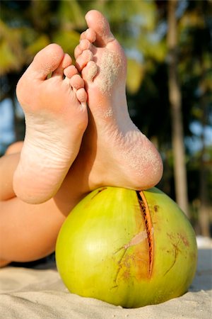 simsearch:400-04912125,k - Women's feet on green coconut on tropical beach Stock Photo - Budget Royalty-Free & Subscription, Code: 400-03978777