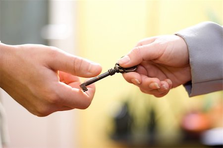 Hands exchanging the key to success Stock Photo - Budget Royalty-Free & Subscription, Code: 400-03978879