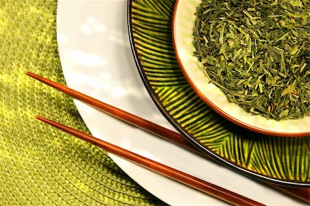 simsearch:400-05153477,k - Asian chopsticks, bowls filled with herbs and green mat Photographie de stock - Aubaine LD & Abonnement, Code: 400-03978949