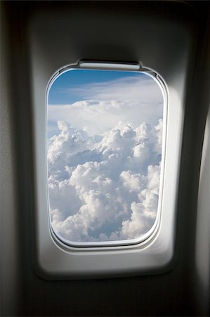 A view of clouds from an airplane window. Foto de stock - Super Valor sin royalties y Suscripción, Código: 400-03979079