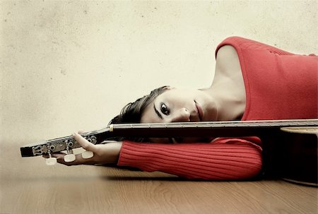 Girl with a guitar, "grain and texture added" Stock Photo - Budget Royalty-Free & Subscription, Code: 400-03979135