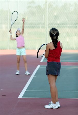 simsearch:400-04461812,k - Two girls at tennis practice Stock Photo - Budget Royalty-Free & Subscription, Code: 400-03979756