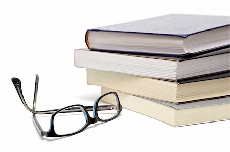 simsearch:6118-07354058,k - Books and reading glasses on white background Stock Photo - Budget Royalty-Free & Subscription, Code: 400-03970405