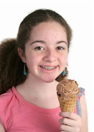 simsearch:400-07920877,k - A cute teen girl with braces holding a chocolate ice cream cone. Stock Photo - Budget Royalty-Free & Subscription, Code: 400-03970435