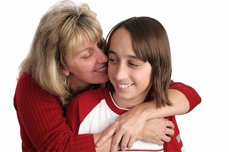 A mother cuddling with her adolescent son. Isolated Stock Photo - Budget Royalty-Free & Subscription, Code: 400-03970499