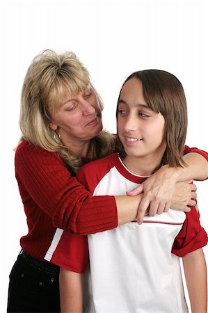 A mother trying to give her skeptical son a hug. Isolated. Stock Photo - Budget Royalty-Free & Subscription, Code: 400-03970502