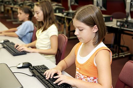 simsearch:400-04484714,k - School children learning computers in the library media center. Stock Photo - Budget Royalty-Free & Subscription, Code: 400-03970512