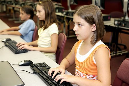 simsearch:400-04484714,k - Students in the school library doing research on computers. Stock Photo - Budget Royalty-Free & Subscription, Code: 400-03970526