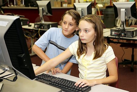 simsearch:400-04484714,k - A girl and a boy student doing research together in the computer lab at school. Stock Photo - Budget Royalty-Free & Subscription, Code: 400-03970527