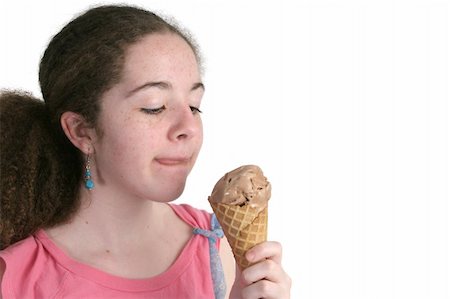 A teen girl enjoying a chocolate ice cream cone. Foto de stock - Super Valor sin royalties y Suscripción, Código: 400-03970532