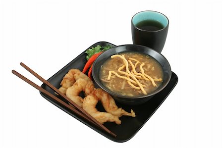 simsearch:400-03970927,k - A bowl of Chinese hot & sour soup with crunchy noodles and golden fried fantail shrimp served with tea.  Clipping path included. Foto de stock - Royalty-Free Super Valor e Assinatura, Número: 400-03970904