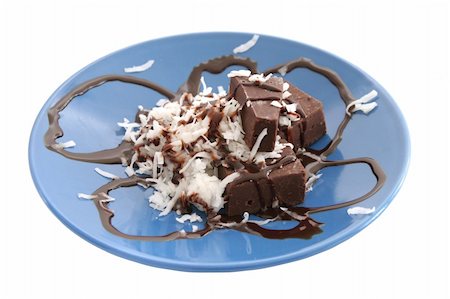 A chocolate and coconut dessert isolated over white. Stock Photo - Budget Royalty-Free & Subscription, Code: 400-03970906