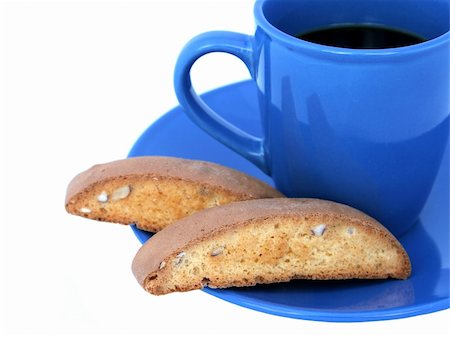 A closeup of biscotti and coffee isolated on white. Stock Photo - Budget Royalty-Free & Subscription, Code: 400-03970917