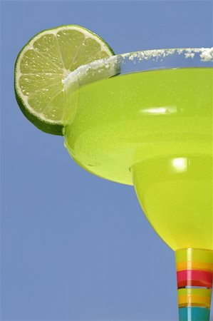 simsearch:659-06306490,k - A delicious margarita with lime in a colorful glass, against a blue sky. Stock Photo - Budget Royalty-Free & Subscription, Code: 400-03970938