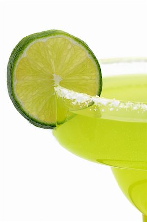 simsearch:659-06306490,k - lime, salt, citrus, tart, sour, margarita, drink, alcohol, glass, rim, salty, green, thirst, thirsty, close, closeup, limes, liquor, tropical, vitamin, c, acidic, food, fruit, fruity, tequila, quench, wet, section, sections, slice, sliced, lemon, lemony, summer, isolated, white, background, mexico, mexican, beverage, beverages Stock Photo - Budget Royalty-Free & Subscription, Code: 400-03970953