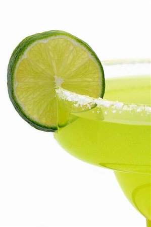 salt rim - lime, salt, citrus, tart, sour, margarita, drink, alcohol, glass, rim, salty, green, thirst, thirsty, close, closeup, limes, liquor, tropical, vitamin, c, acidic, food, fruit, fruity, tequila, quench, wet, section, sections, slice, sliced, lemon, lemony, summer, isolated, white, background, mexico, mexican, beverage, beverages Stock Photo - Budget Royalty-Free & Subscription, Code: 400-03970953