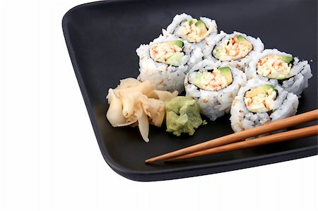 simsearch:400-03970927,k - A sushi california roll on a black plate, partial view  isolated. (plate texture may resemble artifacts) Foto de stock - Royalty-Free Super Valor e Assinatura, Número: 400-03970979