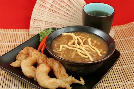 fantail - A bowl of hot & sour soup with chow mein noodles, fried fantail shrimp and hot tea. Stock Photo - Budget Royalty-Free & Subscription, Code: 400-03970981