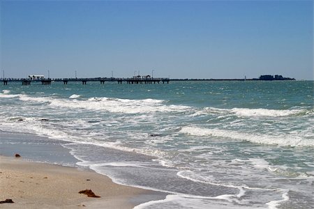 simsearch:632-03630281,k - Waves breaking on a Florida beach, with the pier in the distance.  Ft. Desoto Beach Stock Photo - Budget Royalty-Free & Subscription, Code: 400-03971025
