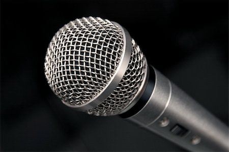 simsearch:649-07063933,k - an extreme closeup view of a microphone on a black background Stock Photo - Budget Royalty-Free & Subscription, Code: 400-03971041
