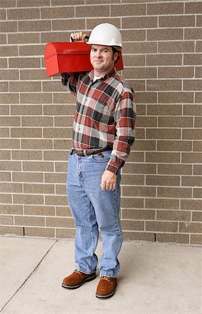 A full body view of a handsome blue collar worker with his toolbox and hardhat. Photographie de stock - Aubaine LD & Abonnement, Code: 400-03971057