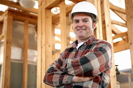 A handsome, friendly construction worker on the job site.  Authentic construction worker on actual construction site. Stock Photo - Budget Royalty-Free & Subscription, Code: 400-03971070
