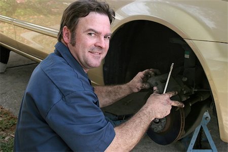 A shifty looking, dishonest mechanic taking advantage of you. Stock Photo - Budget Royalty-Free & Subscription, Code: 400-03971149