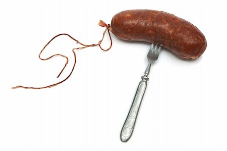 Smoked sausage and plug on a white background Stock Photo - Budget Royalty-Free & Subscription, Code: 400-03971776