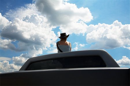 The girl in a cowboy's hat on a roof of the car Stock Photo - Budget Royalty-Free & Subscription, Code: 400-03971771