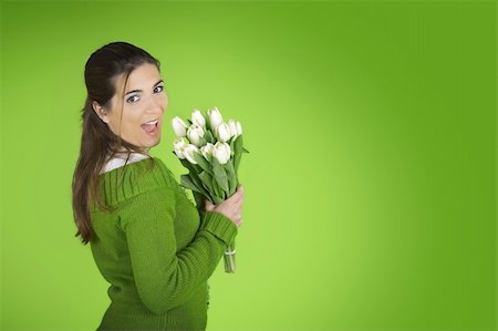 Beautiful woman with tulips on a green background Photographie de stock - Aubaine LD & Abonnement, Code: 400-03972122