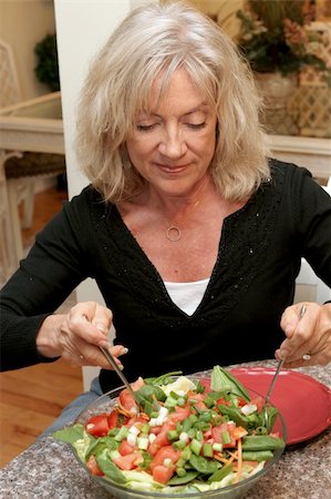 dress for fat women - A beautiful fit woman in her fifties eating a healthy salad. Stock Photo - Budget Royalty-Free & Subscription, Code: 400-03972225