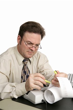 financial highlights - A man going over his accounts using a highlighter to identify issues.  Isolated on white. Stock Photo - Budget Royalty-Free & Subscription, Code: 400-03972254